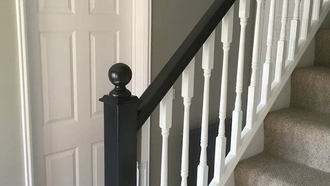 Staircase spindles and newel post finished in white and black