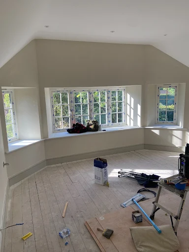 Large loft room repainted in soft neutral tones